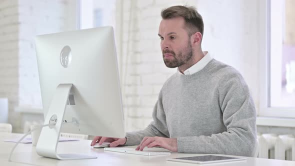 Upset Angry Creative Man Working on Computer