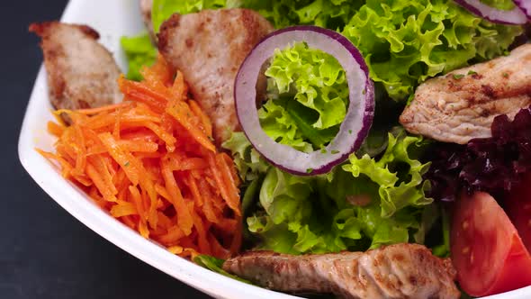 Fresh Salad with Vegetables and Stir-Fried Turkey Strips.