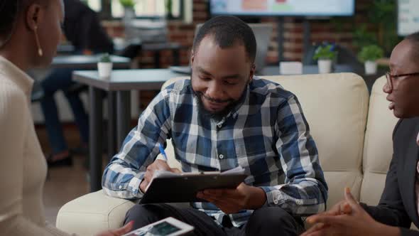 Female Employees Congratulating Man with Successful Ideas