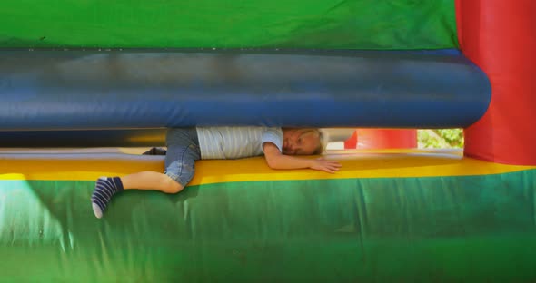 Boy coming out from bouncing castle 4k