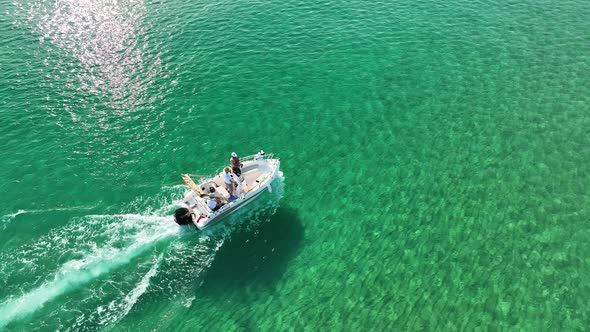 Fishermen fish far out to sea aerial view 4 K