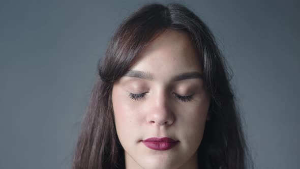 Closeup Portrait Young Brunette Female Looking at Camera Brown Eyes Red Lipstick