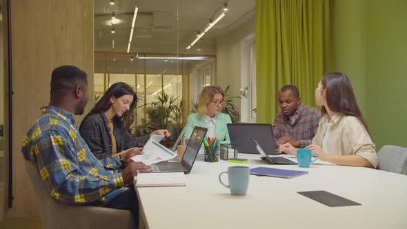 Business Team Working on Project Together at Office