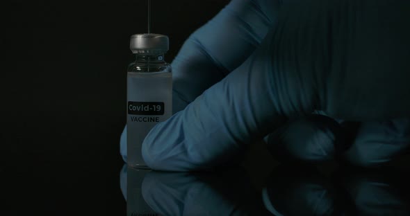 Covid Vaccine Injection And Dark Background