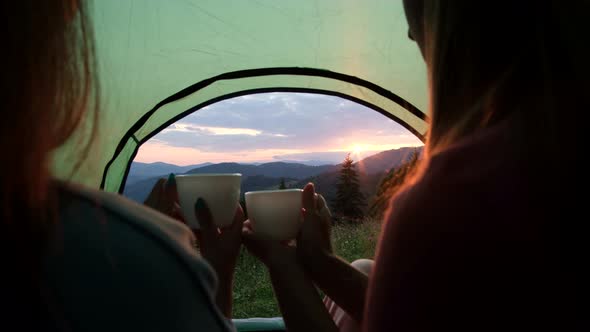 Two People Were Lying in a Tent Overlooking the Mountains