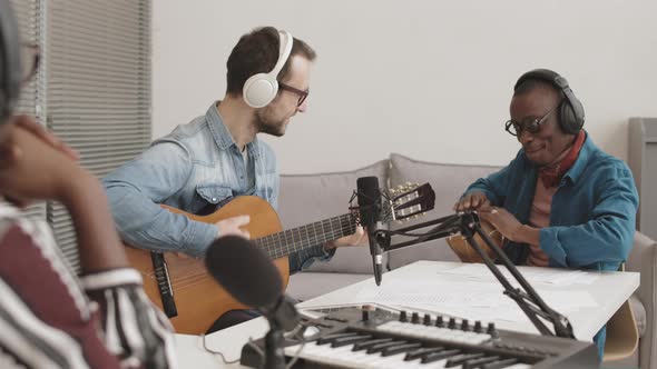 Two Diverse Musicians Having Performance during Radio Program