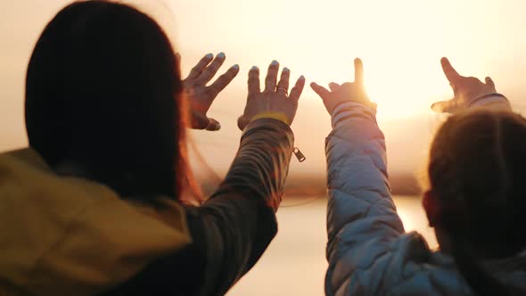 Silhouette of Reaching Helping Hand Hope and Support Each Other Over Sunset