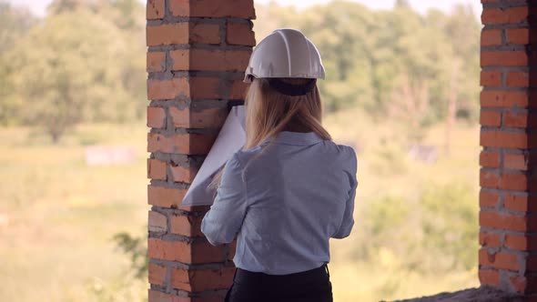 Civil Engineer Checking Construction Site. Woman Architect  Inspecting Real Estate Building.