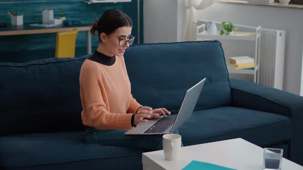 College Student Working on Laptop to Do School Research