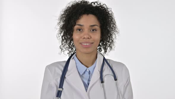 Portrait of Cheerful African Female Doctor Doing Video Chat in Office