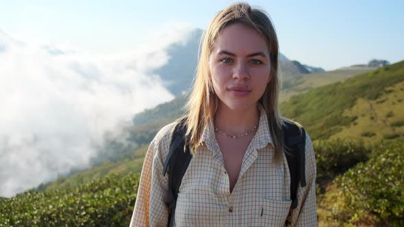 Portrait of Teenage Girl Backpacker in the Mountains