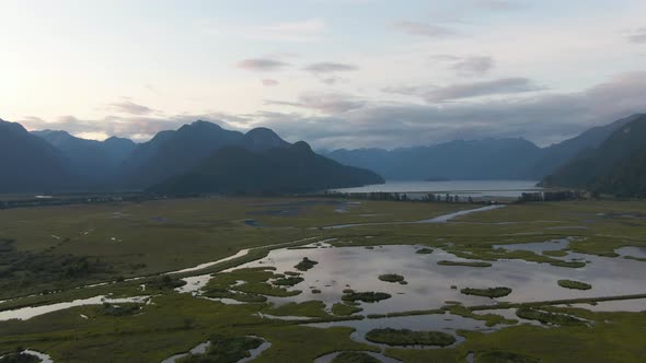 Beautiful Aerial Panoramic View of Canadian Mountain Landscape during a vibrant summer sunset. Taken