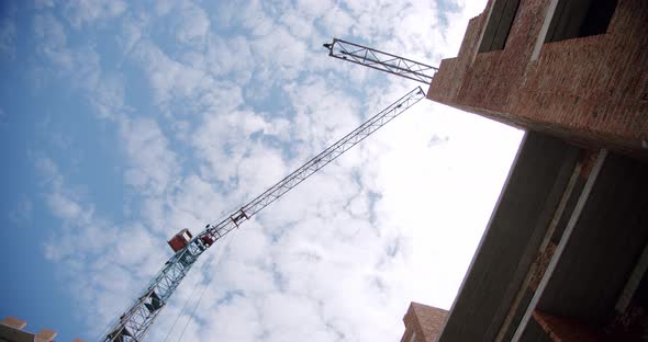 Crane at Building Construction Site, Architecture Apartments. Wide Shot alt
