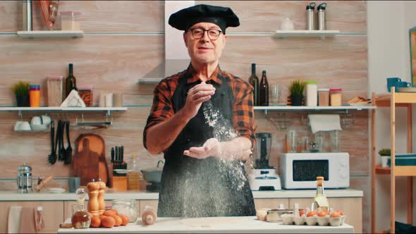 Chef Clapping Hands Filled with Flour