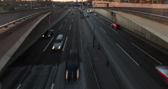 Timelapse of busy city highway in 4k, cars moving on 6 lane motorway