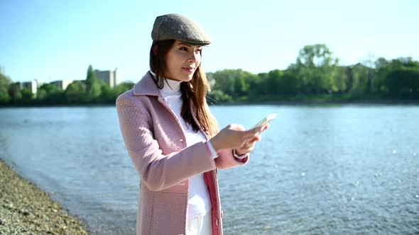 Beautiful young woman with smartphone