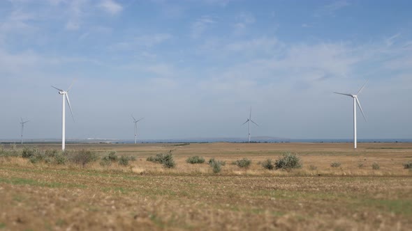 Work of the Group of Wind Power. Wind Power Generator Installed in the Field.