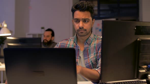 Indian Man with Laptop Working at Night Office 42