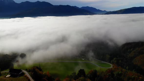 Drone Video of a beautiful landscape in autumn with fog