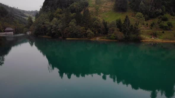 Tranquil Scenery Of Lake With Beautiful Reflections In Kaprun, Austria - aerial drone shot