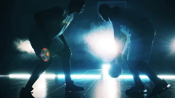 African American Basketball Players are Fighting for a Ball in Slow Motion