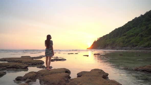 Asian woman enjoy around beautiful beach sea ocean