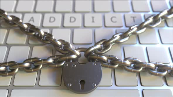 Padlock and Chains on the Keyboard with ADDICT Text