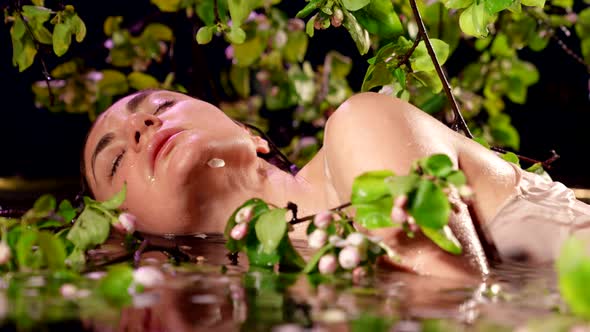 Stunning Lady is Bathing in Shallow of Lake or River Sensual Portrait of Young Woman in Water