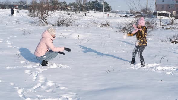 Playing Snowballs in the Forest