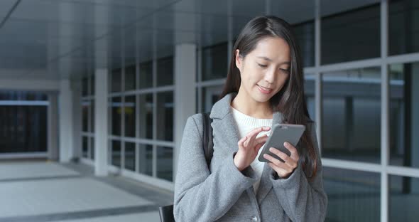 Business woman using mobile phone