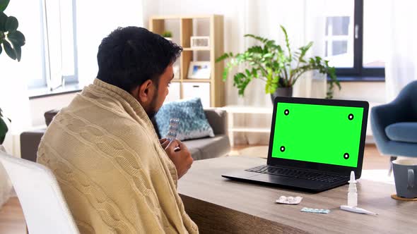 Sick Man with Medicine Having Video Call on Laptop