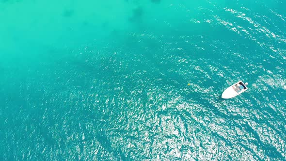 Aerial View of Fishing Boats Swaying on the Waves Off a Paradise Beach Zanzibar