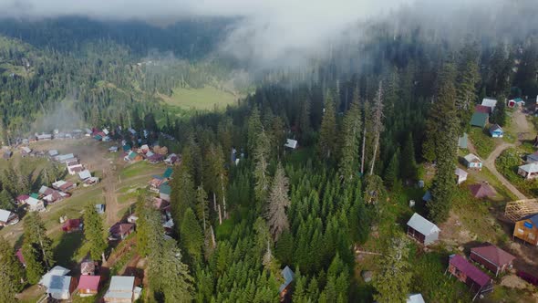 Misty Aerial View Of High Mountain Village