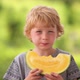 Young Blond Boy Eating Yellow Watermelon - VideoHive Item for Sale