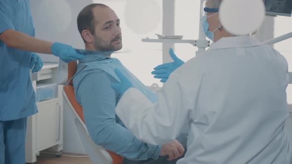 Dentist and Patient Talking About Teeth Radiography Scan