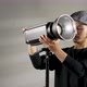 studio portrait of asian young man setting up the lighting for a shoot - VideoHive Item for Sale