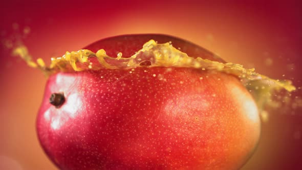 Mango Slice Falling and Splashing on Yellow Pink Background