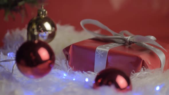Christmas baubles and gift fairy lights background