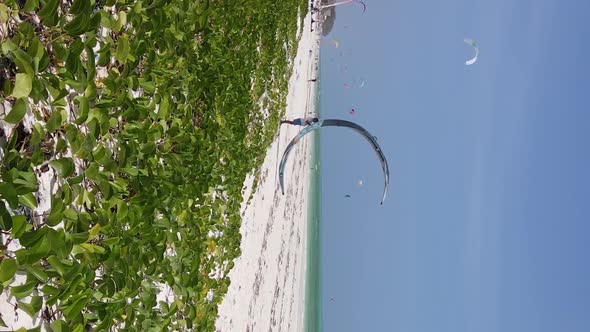 Zanzibar Tanzania  Vertical Video Kitesurfing Near the Shore of Ocean Slow Motion