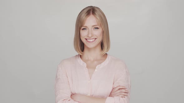 Studio portrait of young, beautiful and natural blond woman.