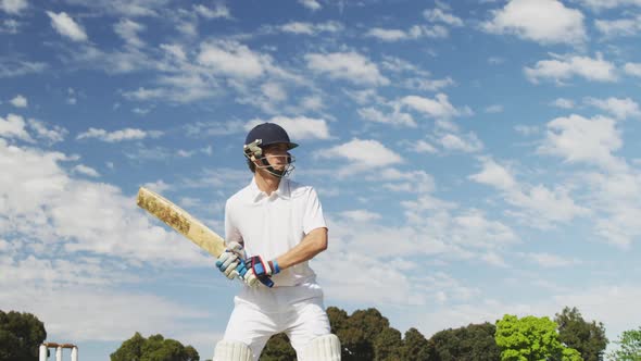 Cricket player shooting in the ball in a pitch