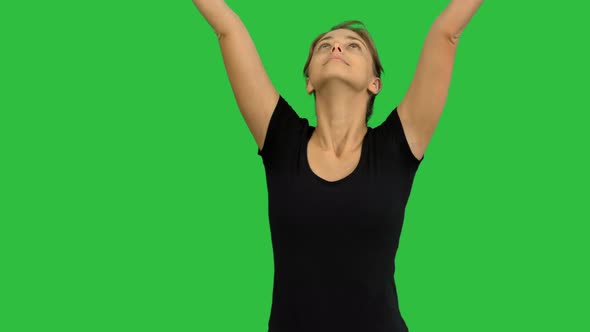 Young Woman Practicing Meditation on a Green Screen, Chroma Key