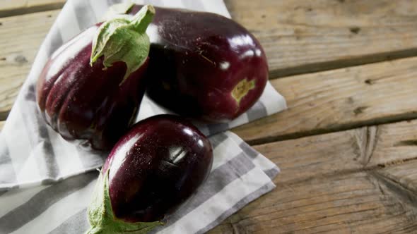 Eggplant on wooden table 4k