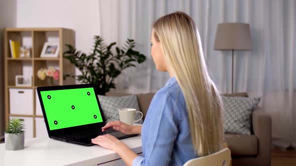 Woman Typing on Laptop with Green Screen at Home 105