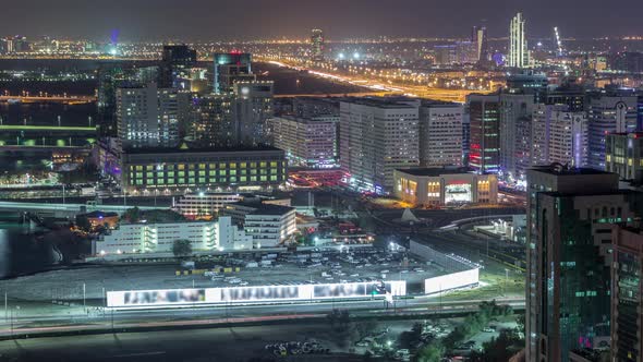 Aerial Skyline of Abu Dhabi City Centre From Above Night Timelapse