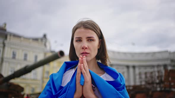 Ukrainian Woman Prays for Peaceful Sky Over Head in Ukraine