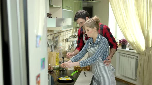 Cheerful Man and Woman Cooking