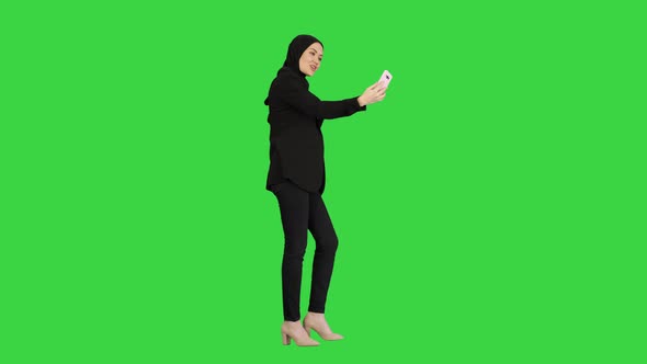 Young Pretty Muslim Woman Hijab Having Video Call Her Phone As She Walks Green Screen Chroma Key