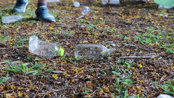 Group of Asian volunteer families collecting garbage and plastic to help save the environment.