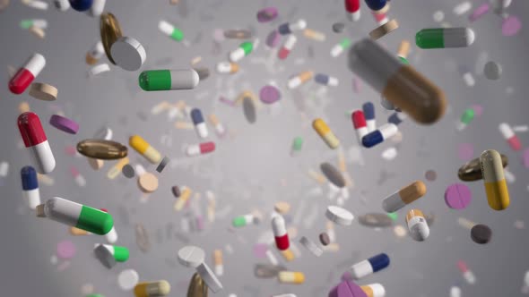 Flying Through Assorted Colorful Pills On White